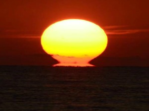 Blazing sun dips it's head into the Atlantic Ocean off Key West Florida