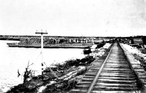 Railroad Ties Being Unloaded from a Barge
