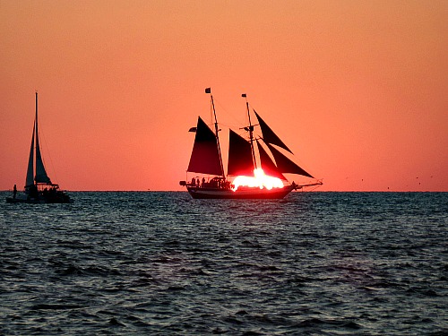 Schooner Against Setting Sun At Key West Sunset Celebration