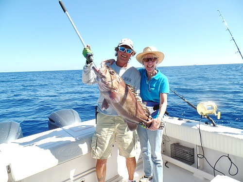 20 pound snowy grouper held by Todd Render and Cathy Sheehan