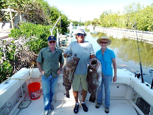 Dan Sheehan, Todd Render and Cathy Sheehan With 2 Large Snowy Grouper Caught Deep Sea Fishing Florida Keys